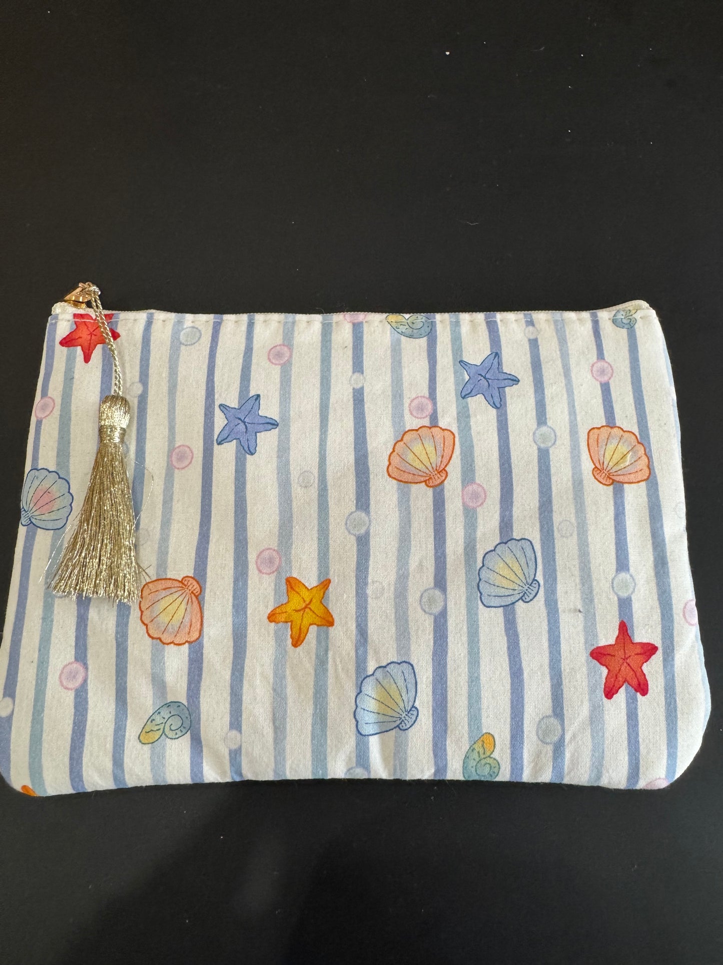 Pochette trousse rayée à motif coquillages